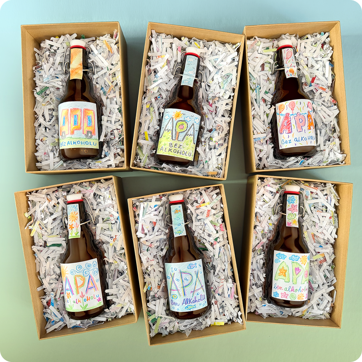 Six-pack of non-alcoholic APA bottles with six children's labels