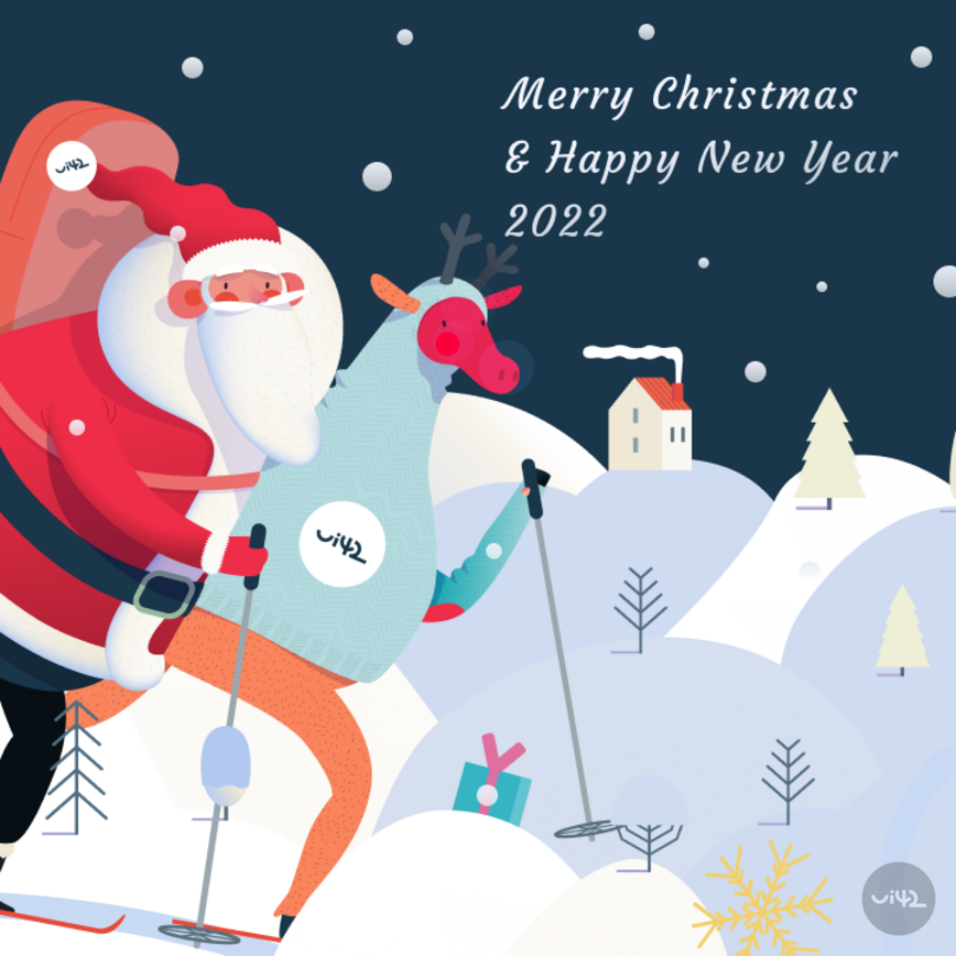 Santa Claus and a reindeer on skis with a Christmas greeting "Merry Christmas & Happy New Year 2022" in a snowy landscape.